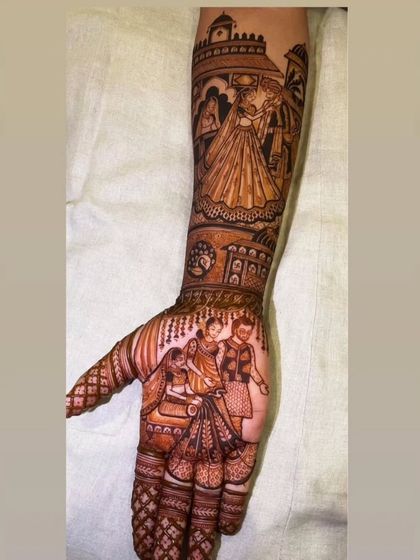 A side view of a narrative bridal mehandi. This design features a couple's portrait on the forearm and a family scene on the palm, telling a complete story.