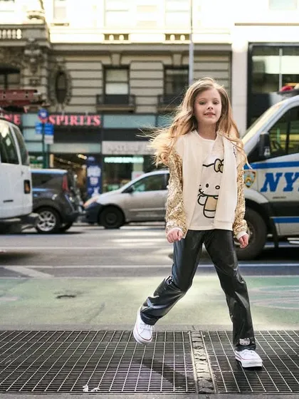 This is from a kids' fashion campaign in New York City. Even in a commercial setting, I look for dynamic, authentic moments. Capturing this shot of her mid-stride against the moving city shows that my style can bring energy and life to brand campaigns.