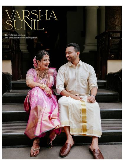 An elegant portrait of the couple seated on the steps of the majestic Kunnathur Mana, a timeless image from their heritage wedding.