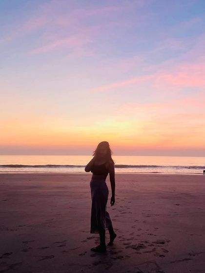 A silhouette against a beautiful sunset. This image captures a moment of quiet reflection, honoring the lessons of the past year and setting intentions for the future.