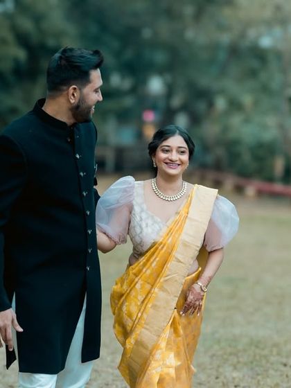 Walking and talking together in a park. This candid shot captures the easy-going nature of their relationship during their pre-wedding session.