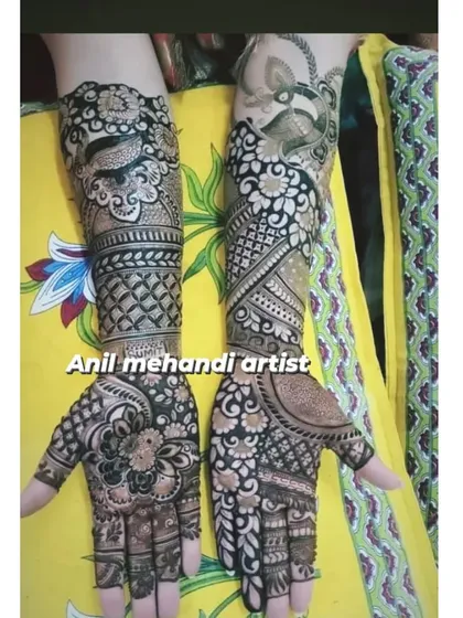 A bold and beautiful design with high contrast. The dark-filled areas make the floral and peacock motifs pop, creating a very striking and traditional look.