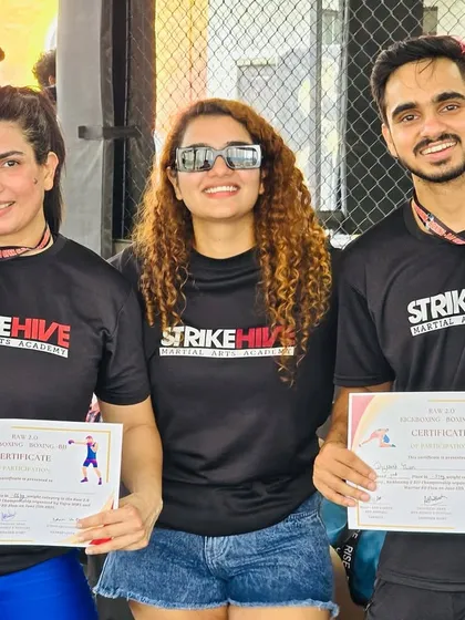 Two of our students proudly display their medals and certificates after spectacular performances at a recent competition.