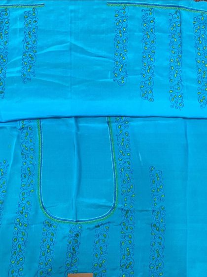 This unstitched blouse piece features paisley motifs embroidered in vertical lines, creating a unique and modern pattern.