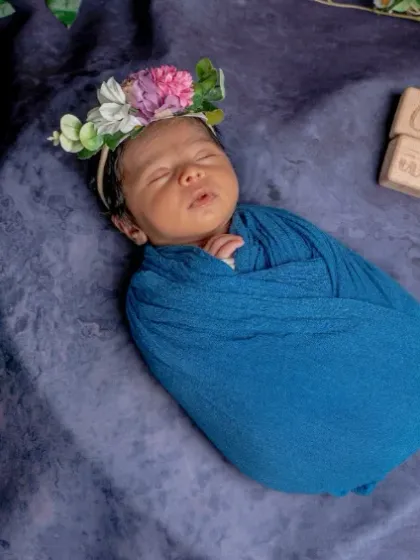 Two weeks of love. I used a simple branch of greenery and some blue flowers to create a natural, organic feel for this milestone photo.