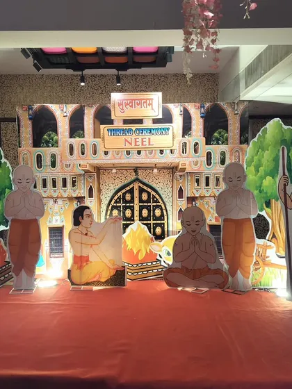 A unique and traditional stage setup for a Hindu thread ceremony, also known as Upanayana. We used custom illustrated cutouts depicting the rituals of the ceremony to create an authentic and meaningful backdrop for the event.