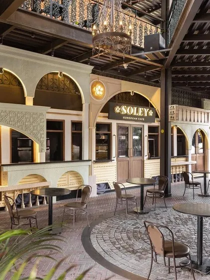 We designed the Soley European Cafe in Bangalore to be a journey through history and modern design. The facade recreates the charm of an Italian streetscape, complete with a vintage tram car entrance and architectural ruins. This commercial project shows how we translate a brand's story into a memorable physical experience for customers.