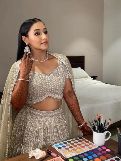 Embracing the hues of celebration. This glam look is all about confidence and style, with a focus on the eyes and a flawless base.