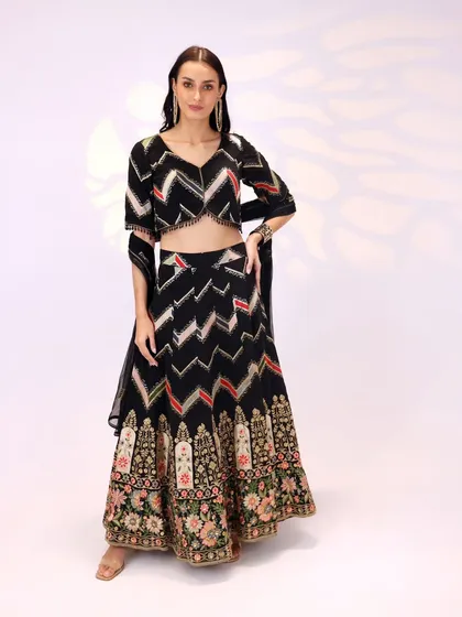 Another angle of the black georgette lehenga, showing how the sheer dupatta can be styled for a light, airy feel.