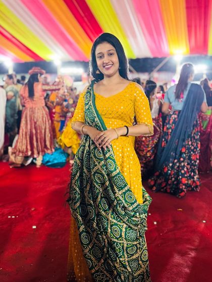 Our client rocking her Navratri look in a yellow anarkali with a green bandhani dupatta. A comfortable yet festive choice.