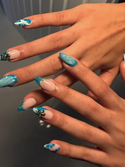 Another pose showing off the "August mood" set. The combination of different art styles on each nail makes it super unique and personalized.