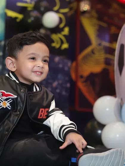 The birthday boy Vihaan, all smiles during his party. Capturing these happy moments is what my service is all about.