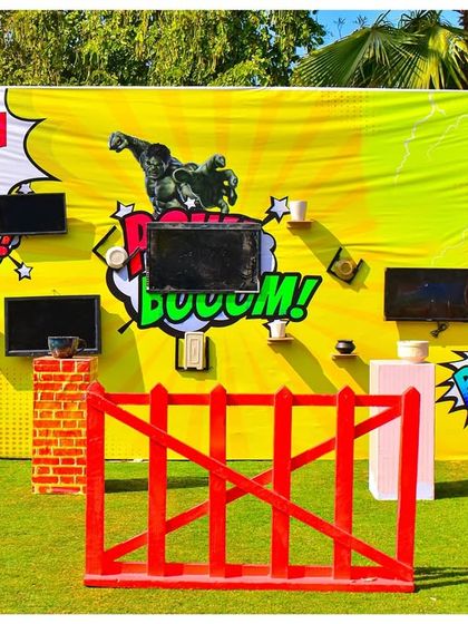 Welcome to the 'Smash Zone'. This interactive game wall, inspired by the Hulk, was a huge hit. It’s a perfect example of how I integrate themed activities directly into the party's decor.