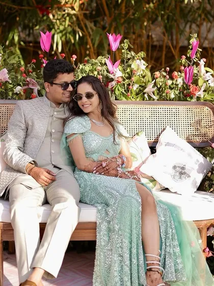 A happy couple enjoying their vibrant pink Mehendi in Jaipur. The decor is designed to create beautiful moments and perfect photo opportunities.