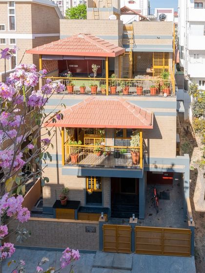 The house framed by spring blossoms.