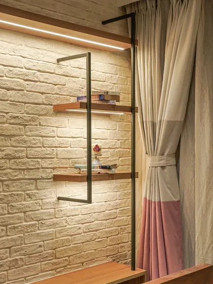 A close-up of the shelving unit from image 27, showing the integrated LED lighting.