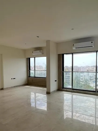 A "before" view of a living area, with bare floors and walls. This image contrasts with the final design, showcasing the dramatic transformation that is possible through thoughtful interior architecture and design.