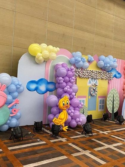 A side angle of the Samriddhi's Peppa Pig stage, showing the layered design of the backdrop and props.