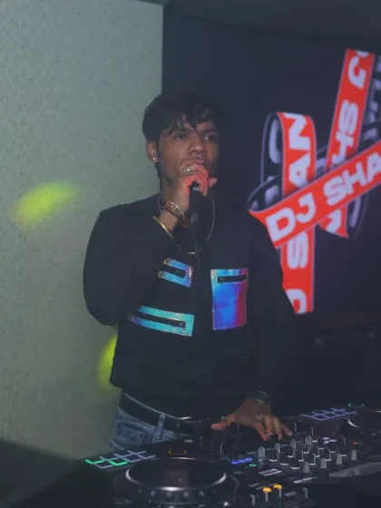 I don't just stand behind the decks. I get on the mic to connect with the crowd and make sure everyone's hands are in the air.