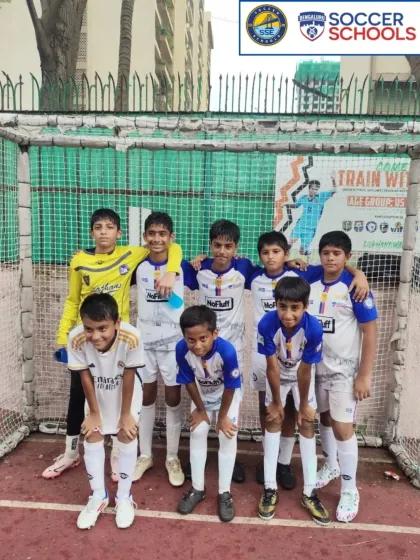 A youth team posing before a match, ready to hit the ground running.