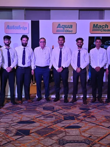 Our dedicated team stands proudly in front of a display of our smart product brands like Hydromat, Autodrip, and Aqua Disc at the 'Udgosh 2.0' event.