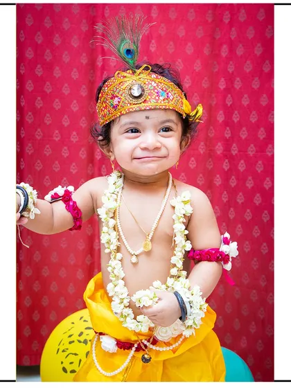 A joyful moment from one of my popular 'Little Krishna' themed photoshoots. I provide all the costumes and props to create these adorable and memorable portraits for your child.