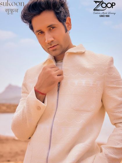 All white, all right. A closer look at the Sukoon white co-ord suit, showing the subtle texture and clean zipper detail that gives it a modern edge.