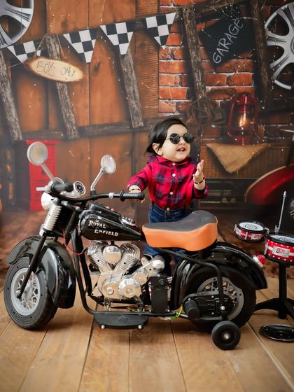 Too cool for school. Adding sunglasses to the biker theme gives this portrait an extra dose of attitude and fun.