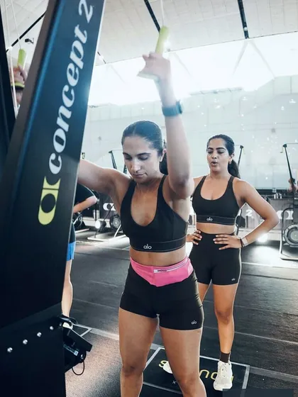 Two members of the Knox crew at a HYROX event, working hard on the Concept 2 SkiErg. This showcases the teamwork and dedication that defines our community, both in and out of the gym.