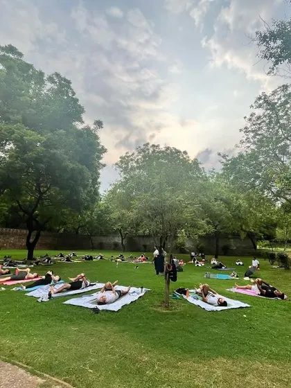 A powerful morning for International Yoga Day. Our community resting in Savasana on the grass.