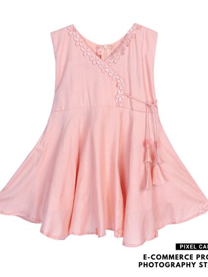 A pink version of the same baby frock, demonstrating our ability to shoot product variations with perfect consistency.