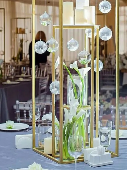 An elegant table setup at our Worli venue, showcasing a modern centerpiece with clean lines and calla lilies. The space provides a sophisticated canvas for any event style.