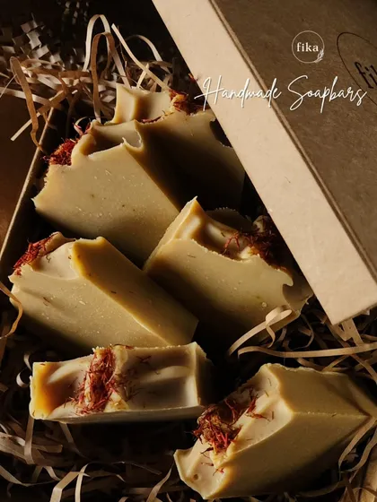 My Turmeric Saffron soap bars are a customer favorite. I use real turmeric for its skin-brightening properties and top each bar with delicate saffron threads, as you can see in this box of freshly made soaps.