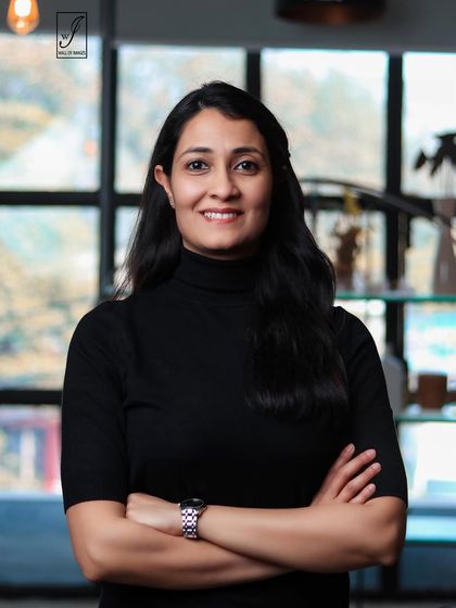 Another friendly and professional portrait with open body language.