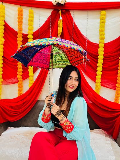 Another pose with the colorful umbrella. This type of content is perfect for showcasing festive accessories and props.