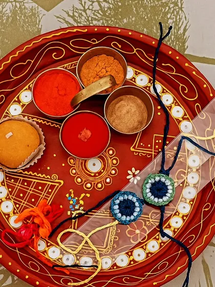 The Rakhi thali is ready. My handmade evil eye rakhis look beautiful as part of the traditional Raksha Bandhan ceremony.