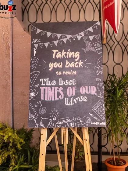 Setting the theme from the moment guests arrived. This chalkboard sign welcomed everyone to the 'Back to School' 25th anniversary party, promising a night of reviving the best times of their lives.