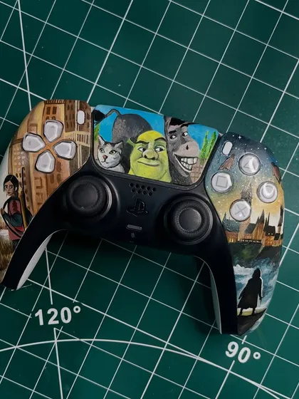 Another view of the multi-fandom PS5 controller, showing the different scenes on each handle.