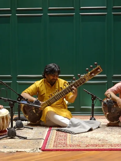 A wide shot of our trio during the recording of our Sitar duet album. The setup shows the professional microphones and arrangement we use to capture the authentic sound of a live classical performance.