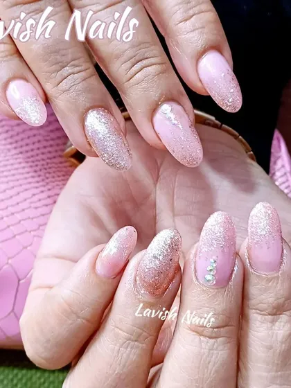 A beautiful rose gold and silver glitter fade on a soft pink base, creating a delicate and sparkling effect.