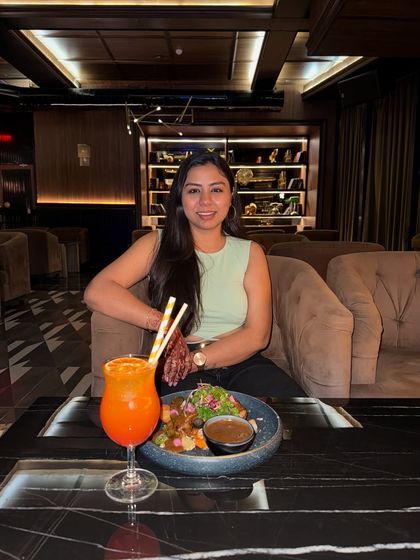Enjoying a delicious meal and a refreshing drink at Limitless Luxe in Noida. The hospitality, ambiance, and food make it a must-have dining experience.