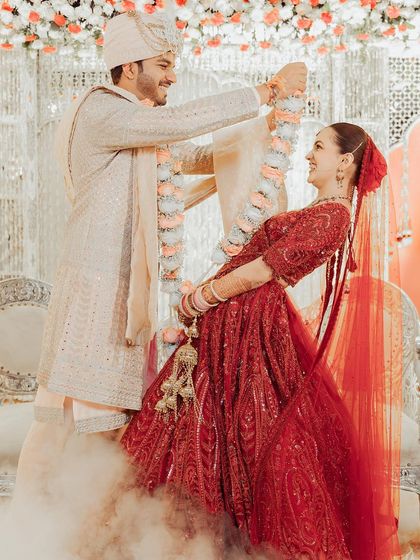 The jaimala moment. A candid shot full of joy and movement.