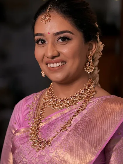 A beautiful portrait of my South Indian bride. The focus is on clean, glowing skin and eyes that sparkle, a perfect example of minimal yet impactful bridal makeup.