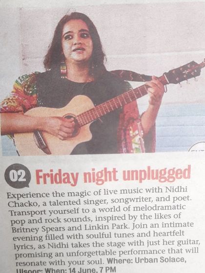 A newspaper clipping for Nidhi Chacko's 'Friday Night Unplugged' performance. Her soulful tunes and heartfelt lyrics promised an unforgettable evening.