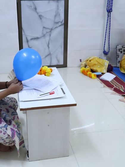 An instructor uses a balloon as a visual aid to explain breathwork during our in-person Meditation Teacher Training Program. We use creative methods to make complex concepts easy to understand.