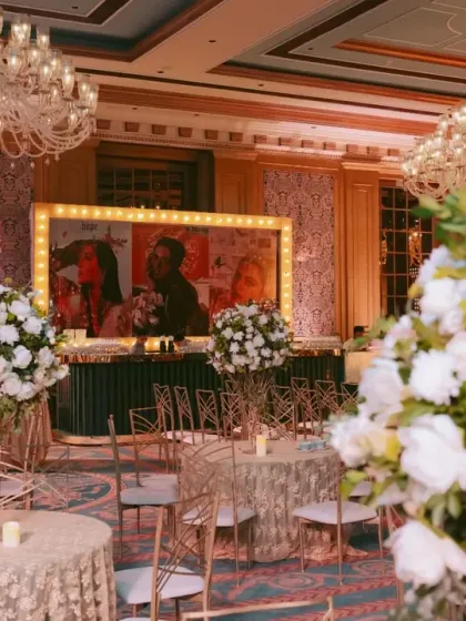 The bar area at a Bollywood-themed Sangeet, with a custom, movie-style poster of the couple. These personalized details make the event feel exclusive and fun.