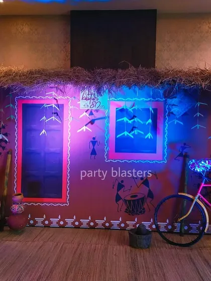 This immersive photo booth was the centerpiece of a corporate party with an Indian village theme. We used authentic materials like hay and woven baskets, combined with creative lighting and rustic props like a decorated bicycle, to create a memorable and interactive experience.
