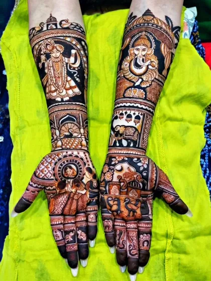 This is the kind of detail I love to create for my brides. This full-arm bridal mehendi features intricate portraits of Radha-Krishna and Lord Ganesha, ensuring a design that is not only beautiful but also deeply meaningful and blessed.
