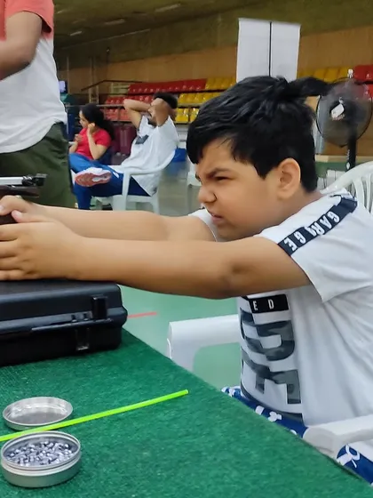 Intense focus from a young shooter during one of our beginner courses. We teach children how to channel their concentration, a skill that is valuable both on the shooting range and in their academic life.
