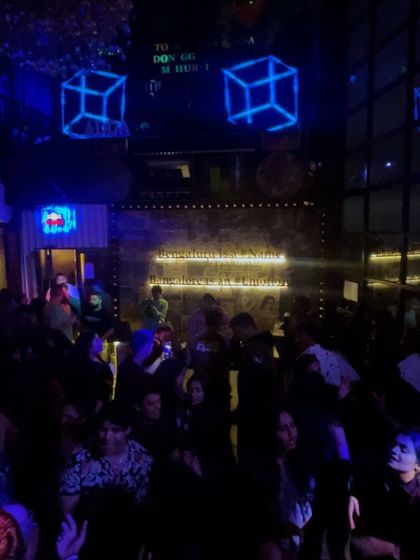 The scene at Bombay Adda, where the decor is as cool as the music. The sign says it all: Bangalore is an Emotion.